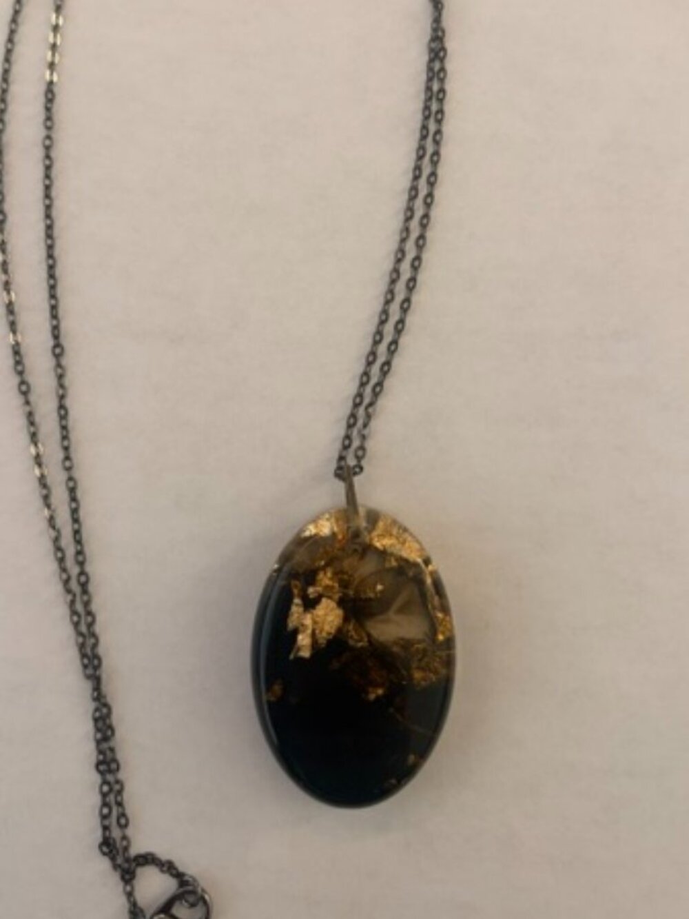 Handcrafted Oval Resin Necklace – Black & Gold Foil Leaf Pendant